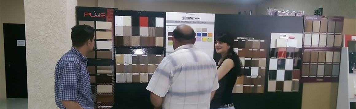 Showroom area at Old Lami Ltd., showing displays of MFC laminate (lamitati) products, High Gloss MDF products, Acrylic MDF products and others such as furniture accessories, white painted HDF etc., all at the showroom in Didube, Tbilisi, Georgia.