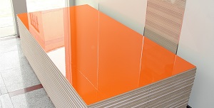 Photo of a stack of high gloss laminate (laminati) product, either HG MFC, MF-MDF, Acrylic faced MDF or PVC faced MDF.